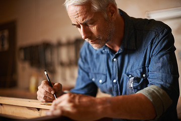 Image showing Carpentry, furniture manufacturing and man with pencil, focus and wood design workshop at small business. Creativity, thinking and professional, senior carpenter working on wooden designer project.