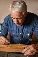 Image showing Carpentry, wood and man with pencil, focus and thinking at designer furniture manufacturing workshop. Creativity, small business and professional carpenter working on design for sustainable project.