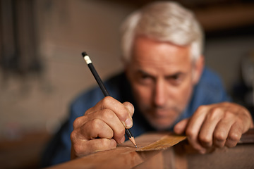 Image showing Carpentry, hands of man with pencil, measurement and professional furniture manufacturing workshop. Creativity, small business and focus, expert carpenter working on sustainable wood project design.