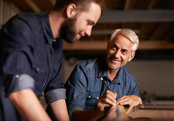 Image showing Smile, learning and carpenter with apprentice in training, man teaching professional furniture manufacturing. Mentorship, expert carpentry and happy man with student working at wood project workshop.