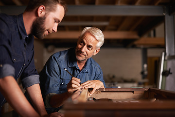 Image showing Carpentry workshop, learning and man with apprentice teaching expert tips and help for furniture manufacturing. Mentorship, professional carpenter and student in training working on wood work project