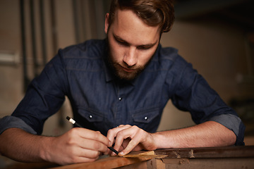 Image showing Carpentry, furniture design and man with pencil, wood and designer table manufacturing workshop. Creativity, small business trade and expert carpenter with focus on sustainable woodwork project craft