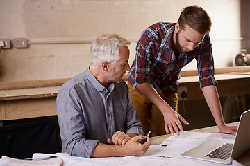 Image showing Architecture, teamwork and father and son with blueprint in workshop for collaboration on laptop. Senior engineer, men and paperwork of trainee or apprentice working on design and plan with mentor.