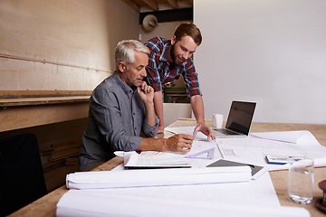 Image showing Carpentry, teamwork and men with blueprint in workshop for collaboration. Senior architect, design and father and son planning, discussion and working on building project of apprentice with mentor.