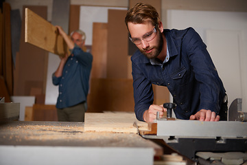 Image showing Carpentry team, carpenter and men work in workshop on design project with vocation and creative skill. Collaboration, teamwork and male cutting wood with power tools, father and son working together