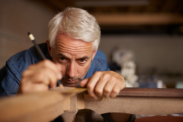 Image showing Focus, furniture manufacturing and carpenter with pencil, table and antique restoration workshop. Creativity, small business and professional carpentry measurement for sustainable wood project design