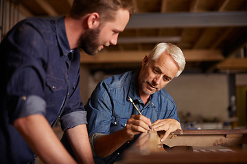 Image showing Carpentry, learning and man with apprentice in training, teaching and tips for professional furniture manufacturing. Mentorship, expert carpenter and student working at wood design project workshop.