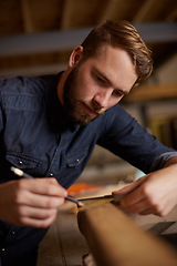 Image showing Woodwork, measurement and carpenter with pencil, wood restoration and furniture manufacturing workshop. Focus, small business and expert carpentry trade, man working on sustainable project design.