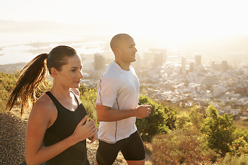 Image showing Sunrise, fitness and coach running with woman as workout or morning exercise for health and wellness together. Sport, marathon and runner run with man athlete for training for energy or sports