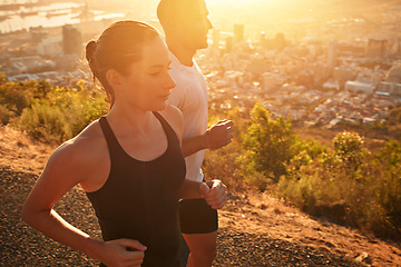 Image showing Sunrise, fitness and personal trainer training woman as workout or morning exercise for health and wellness. Sport, marathon and runner run with man athlete in a city for sports and energy