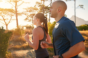 Image showing Sunrise, forest and friends running as exercise or morning workout for health and wellness together. Sport, man and woman runner on trail run with athlete as training in nature for sports or energy