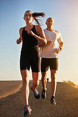 Image showing Sunrise, marathon and friends running as workout or morning exercise for health and wellness together. Sport, man and woman runner run with athlete as training, sports or energy on a road