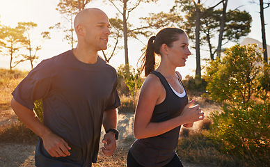 Image showing Sunrise, forest and couple on trail run as workout or morning exercise for health and wellness together. Sport, man and woman runner run with athlete as training on a mountain for sports or energy