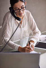 Image showing Telephone, write and female secretary on a call doing research on internet with laptop. Technology, landline and professional corporate receptionist working on project with computer in the workplace.