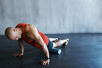 Image showing Gym training, foam roller and man doing floor push up for exercise, health performance and muscle building workout. Fitness club mock up, stretching and strong person focus on strength challenge