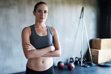 Image showing Serious woman, fitness and portrait with arms crossed in confidence for workout, exercise or training at gym. Strong, fit and confident active female in bodybuilding, healthy wellness and sports