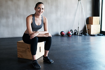 Image showing Exercise portrait, sitting or relax woman happy for health goals success, fitness studio progress or gym training. Motivation, commitment and healthy athlete, person or personal trainer smiling