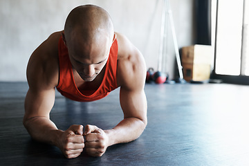 Image showing Gym, focus and man doing floor plank exercise, health performance or core strength building for bodybuilding. Training, commitment and person concentrate on fitness, muscle development or workout