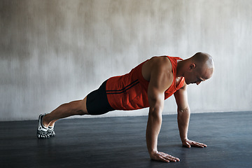 Image showing Workout, muscular and man doing push up for exercise, health performance and sports training for muscle building. Bodybuilding mockup, healthy gym body and strong person doing studio floor pushup