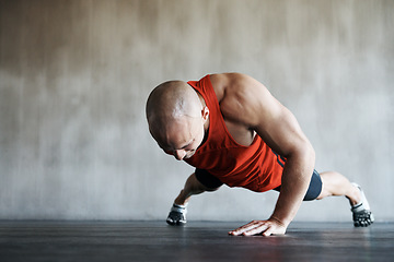 Image showing Gym, man and one arm push up for exercise performance, workout determination and sports training focus. Athlete discipline, strength endurance mockup or active male person concentrate on floor pushup