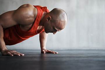 Image showing Workout, endurance focus and man doing push up for strength exercise, gym commitment and muscle power endurance. Fitness mockup, motivation and person concentrate on training, exercising or practice