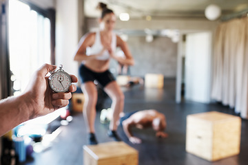 Image showing Exercise, people and hand of coach with timer for gym workout, muscle training or health cardio. Clock, sports fitness and team exercise challenge with personal trainer recording stopwatch time