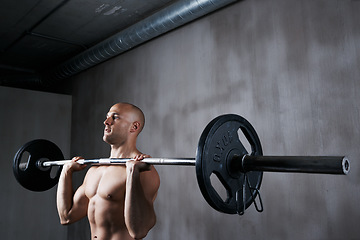 Image showing Fitness, man and weightlifting with barbell for exercise, bodybuilding or arm workout at the gym. Fit, active or strong muscular bodybuilder male lifting weight for intense strength or power indoors