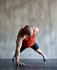 Image showing Strong man, floor and one arm push up for gym studio exercise, bodybuilder workout or sports training. Fitness club motivation, endurance mockup and male athlete doing floor pushup for health goals