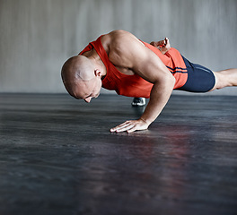 Image showing Training, muscle strength and strong man doing push up for studio floor performance, gym routine or health club commitment. One arm pushup, motivation and male person workout, exercising or fitness