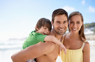 Image showing Beach, summer and portrait of a family on vacation, travel or fun trip with a smile. Man, woman and child or son together on holiday or adventure at sea with happiness, love and care on blue sky