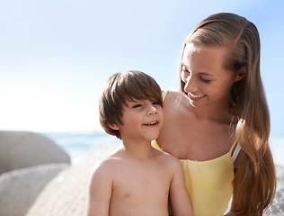 Image showing Child, mother or family at beach with sunscreen on nose for sun protection on travel holiday in summer. A woman and kid happy together on vacation at sea with blue sky, skincare lotion and happiness