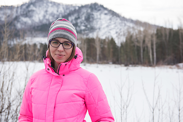 Image showing Happy woman relaxing on the top of mountain