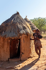 Image showing Himba woman with in the village, namibia Africa