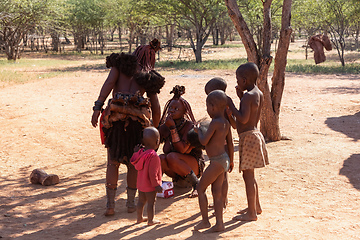 Image showing Himba woman with child in the village