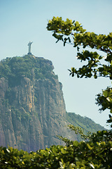 Image showing Brazil, monument and Christ the Redeemer on mountain for tourism, sightseeing and travel destination. Traveling, global architecture and statue, sculpture and city landmark on Rio de Janeiro on hill