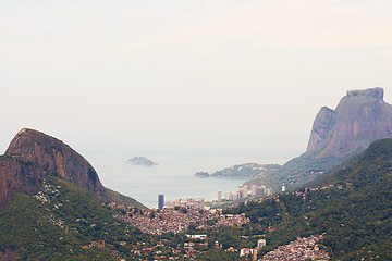 Image showing Brazil, landscape and aerial of city in mountain for traveling destination, holiday and global vacation. Travel, Rio de Janeiro and view of cityscape by ocean for tourism, sightseeing and background