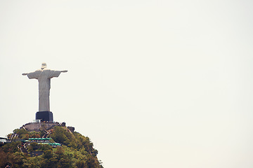 Image showing Brazil, statue and aerial of Christ the Redeemer on hill for tourism, sightseeing and travel destination. Traveling, Rio de Janeiro and drone view of monument, sculpture and city landmark on mountain