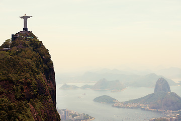 Image showing Mountain, monument and aerial of Christ the Redeemer on hill for tourism, sightseeing and travel destination. Traveling mockup, Rio de Janeiro and statue, sculpture and city landmark by Brazil ocean