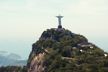 Image showing Statue, monument and Christ the Redeemer in Brazil for tourism, sightseeing and global destination. Travel mockup, Rio de Janeiro and aerial view of landscape, sculpture and city landmark on mountain