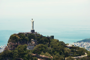 Image showing Landscape, monument and Christ the Redeemer in Brazil for tourism, sightseeing and travel destination. Traveling mockup, Rio de Janeiro and aerial view of statue, sculpture and landmark on mountain