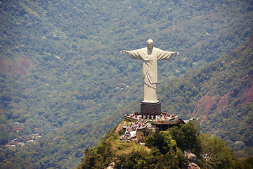 Image showing Landscape, monument and Christ the Redeemer statue for tourism, sightseeing and travel destination. Traveling, Rio de Janeiro and aerial view of architecture, sculpture or landmark on Brazil mountain