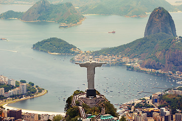 Image showing Brazil landscape, city and Christ the Redeemer on hill for tourism, sightseeing and travel destination. Traveling, Rio de Janeiro and aerial view of statue, sculpture and global landmark on mountain