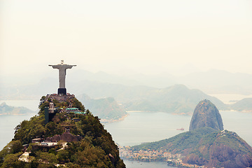 Image showing Landscape, monument and aerial of Christ the Redeemer for tourism, sightseeing and travel destination. Traveling, Rio de Janeiro and drone view of statue, sculpture and Brazil landmark on mountain