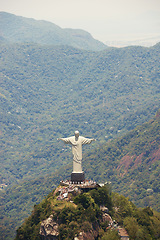 Image showing Travel, monument and Christ the Redeemer in Rio on hill for tourism, sightseeing and global destination. Traveling, architecture and drone view of statue, sculpture and Brazil landmark on mountain