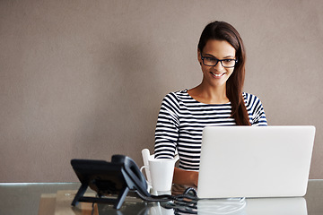 Image showing Laptop, mockup and business woman in office for planning, management and checking email on wall background. Happy, inspired and female manager online for project, proposal or creative idea research