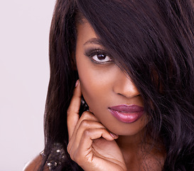 Image showing Beauty, portrait and woman in studio for makeup, cosmetics and glamour treatment. Closeup, face and young african female model pose with luxury, glow and skincare results, confidence and self care