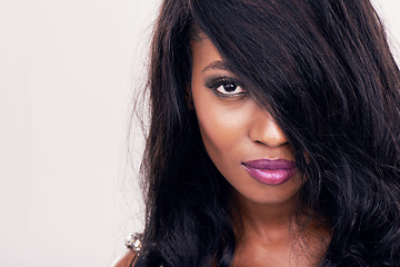 Image showing Portrait, hair and beautiful black woman in studio for keratin, treatment and cosmetics on white background. Haircare, extensions and face of model pose with weave, wig and brazilian beauty results