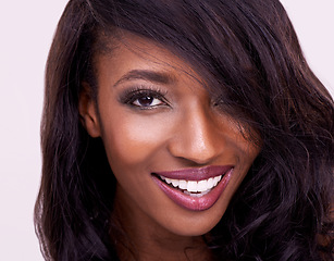 Image showing Makeup, beauty and happy woman portrait in studio for glamour, treatment and cosmetics, cheerful and confident. Face, smile and beautiful african female model posing with glowing skin in closeup