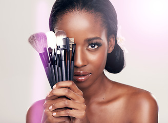 Image showing Cosmetics, makeup and portrait of black woman with brushes in studio with cosmetic application tools. Skincare, flare and skin care, face of beauty model with luxury contour brush on white background