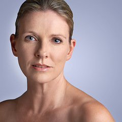 Image showing Face, skincare and portrait of mature woman doing cosmetic skin care facial isolated in a grey studio background. Cosmetics, wellness and old female model calm with natural beauty due to anti aging